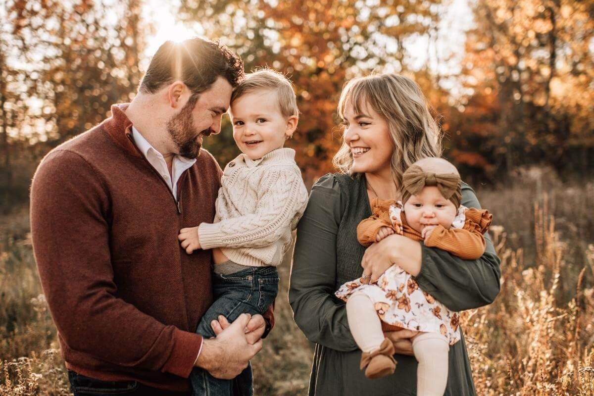 Family of 4 during fall photos, mom, dad, toddler boy and baby girl