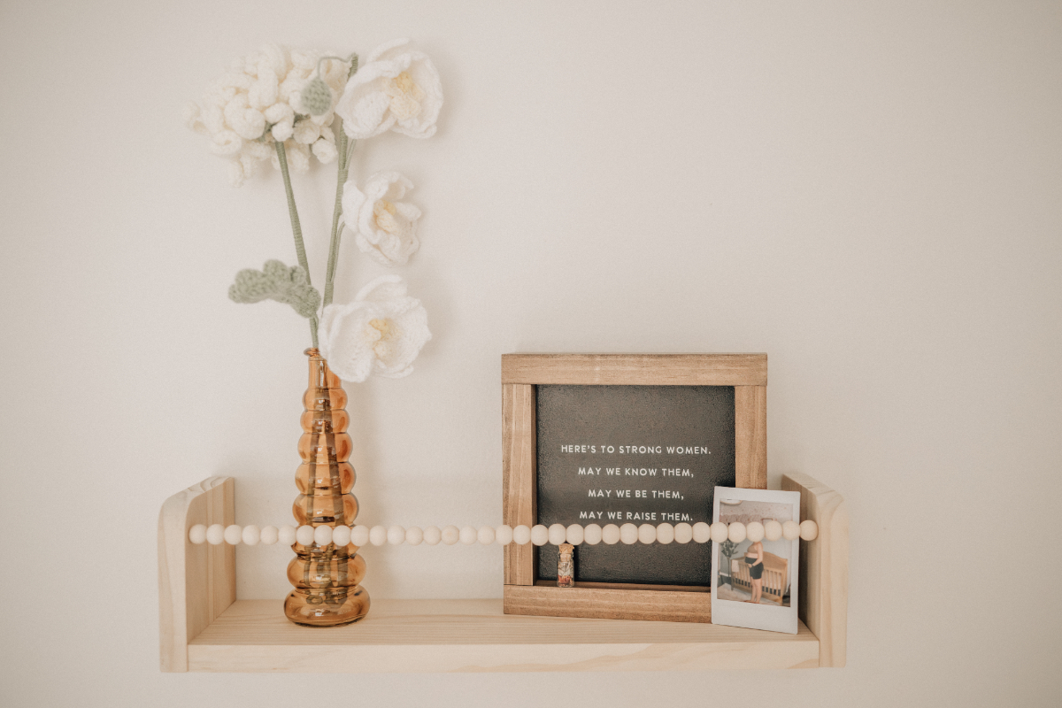 Minimal nursery decor and framed details for newborn baby photos.
